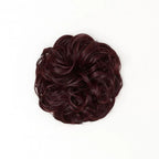 STRANDED HEAT RESISTANT CURLY MESSY BUN